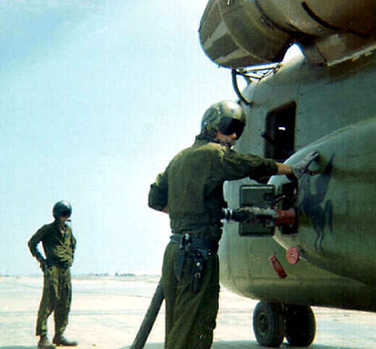 A CH-53 gets fueled
