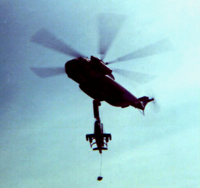 A Cobra is Slinged Under a CH-53